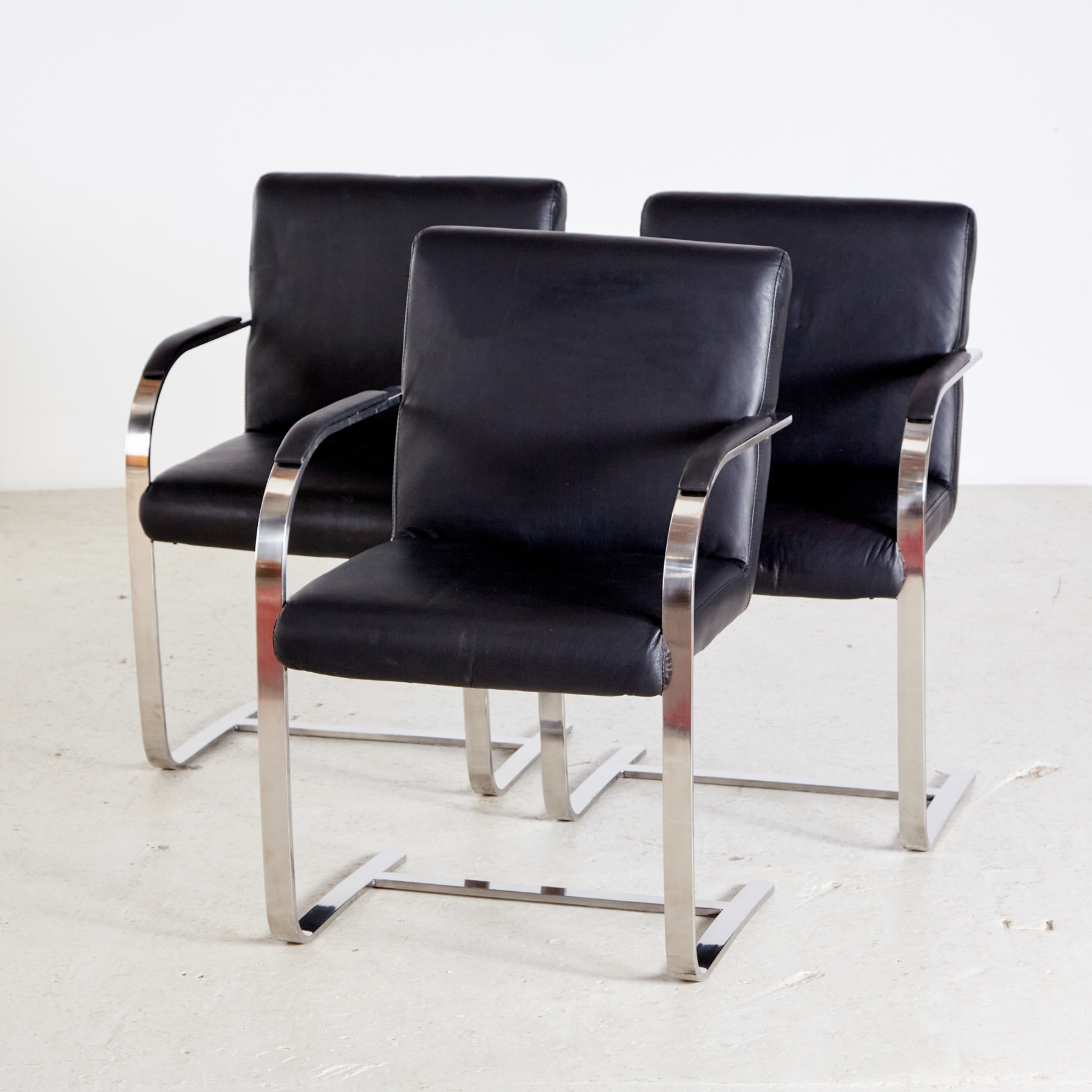 Steel armchair with leather upholstery